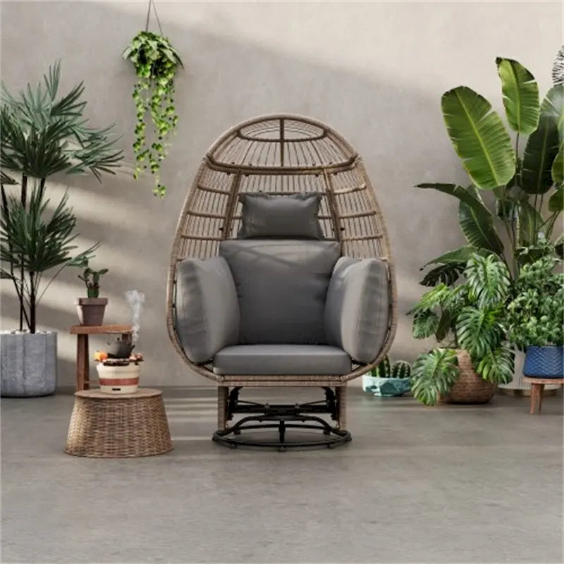 Fauteuil pivotant de jardin en rotin en forme d'œuf avec coussins et fonction à bascule