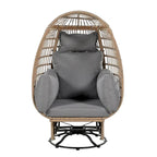 Fauteuil pivotant de jardin en rotin en forme d'œuf avec coussins et fonction à bascule