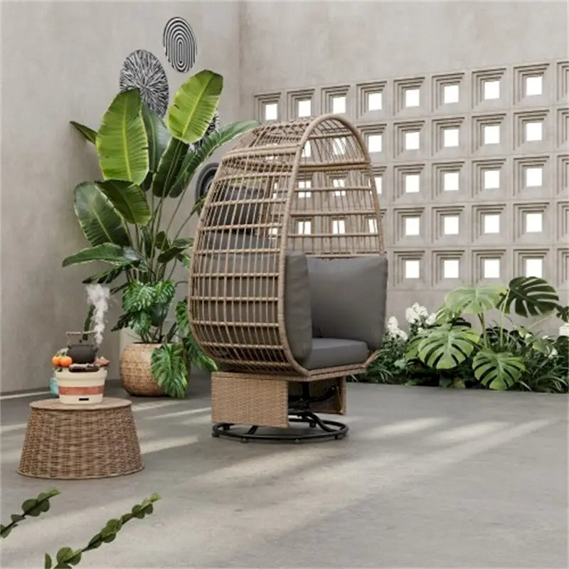 Fauteuil pivotant de jardin en rotin en forme d'œuf avec coussins et fonction à bascule